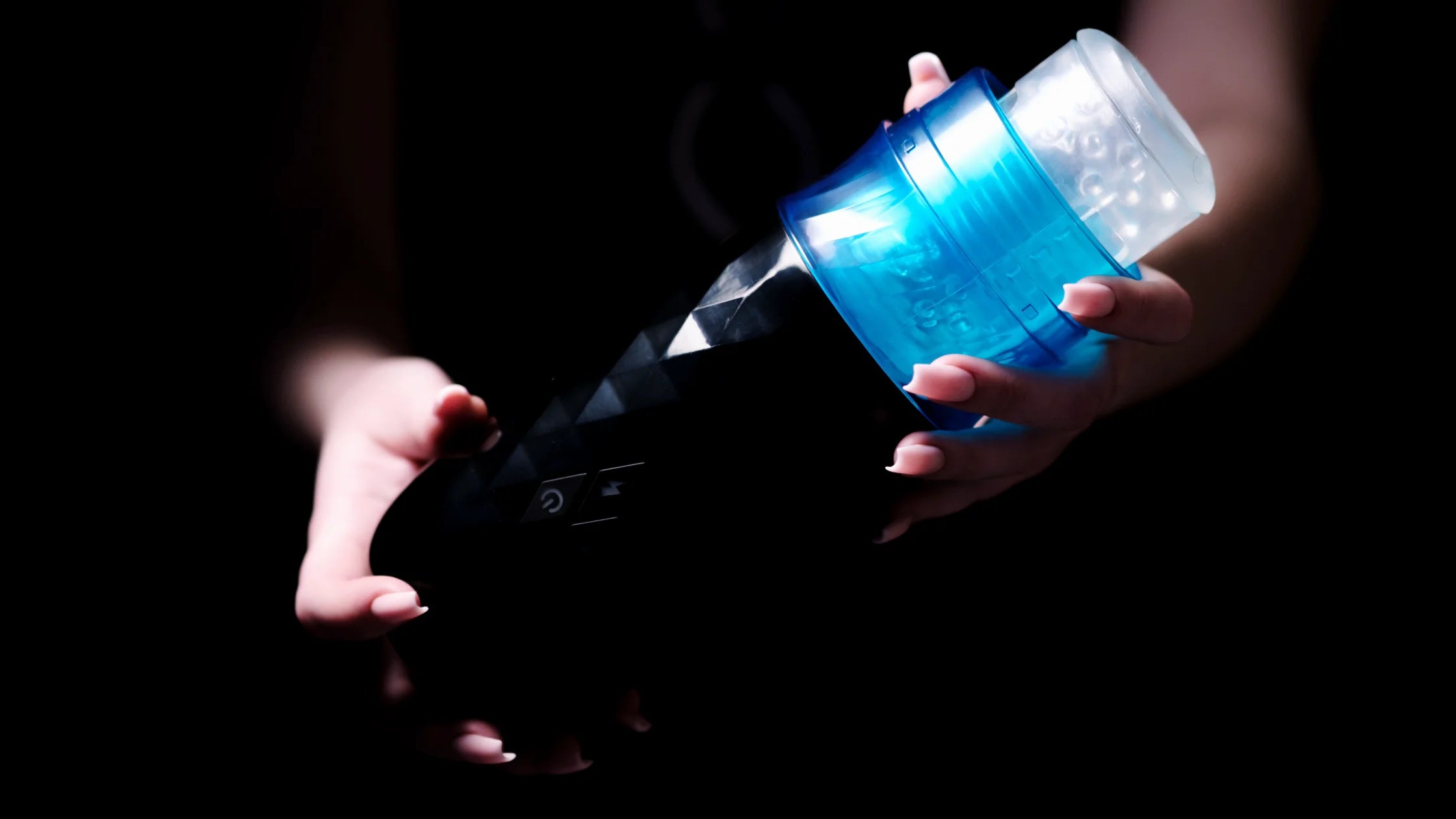 hands holding male masturbator auto stroker sex toy numen wellness