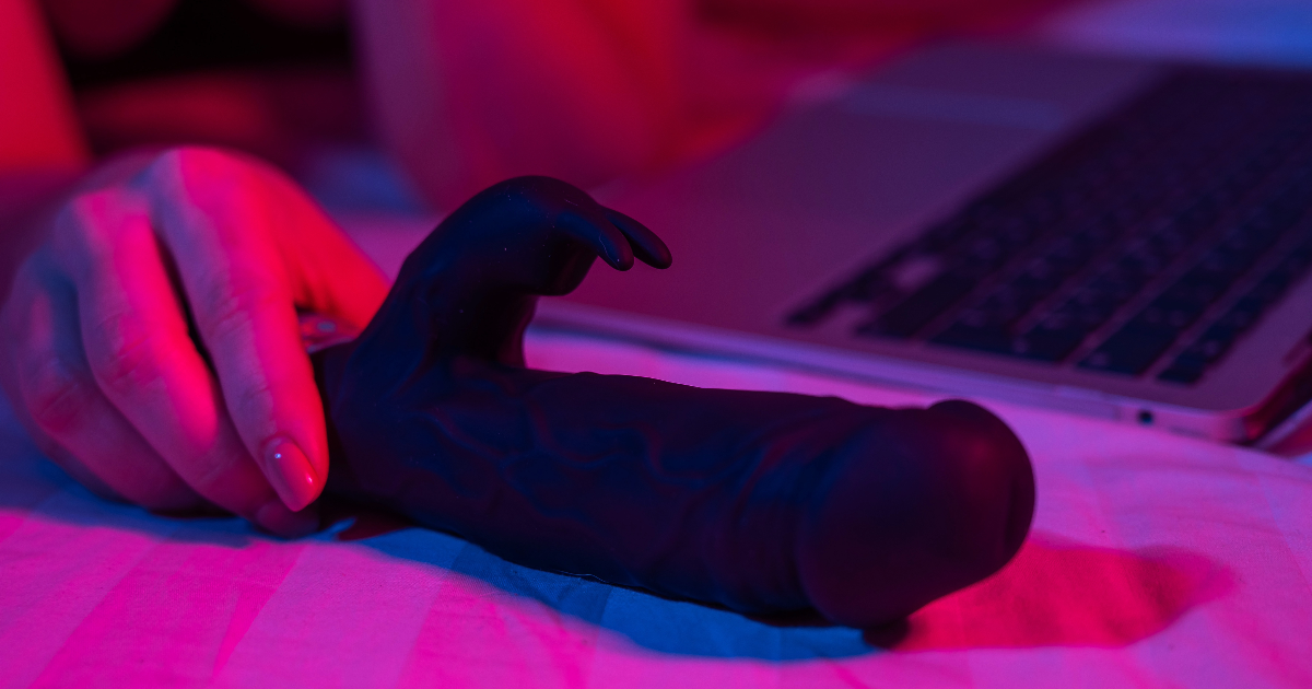 rabbit vibrator black hand pink nails laptop numen wellness