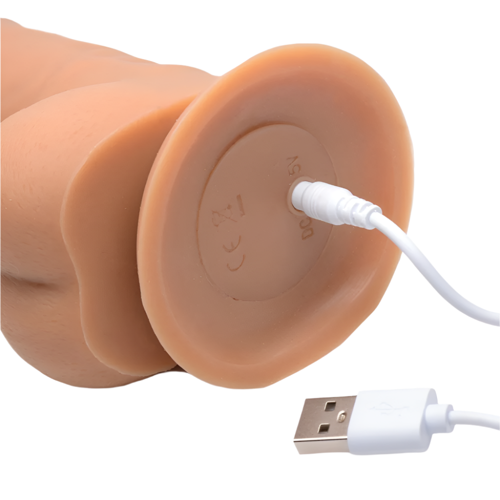 Thrusting Vibrator in flesh tone front view with lifelike details with USB Charger