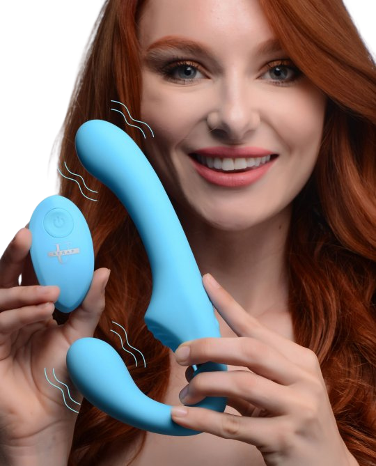 red head model holding velvety smooth blue, double-ended strapless strap-on with blue remote sex toy numen wellness