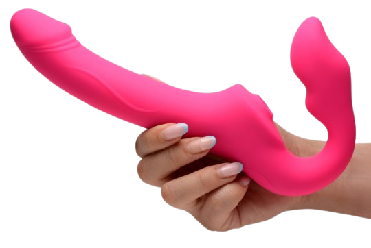 Pink strapless strap-on with curved design in hand