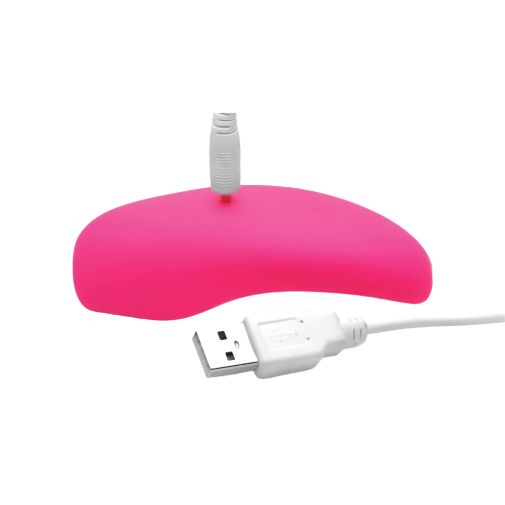 Pink silicone panty vibrator with remote close-up side view USB Charger