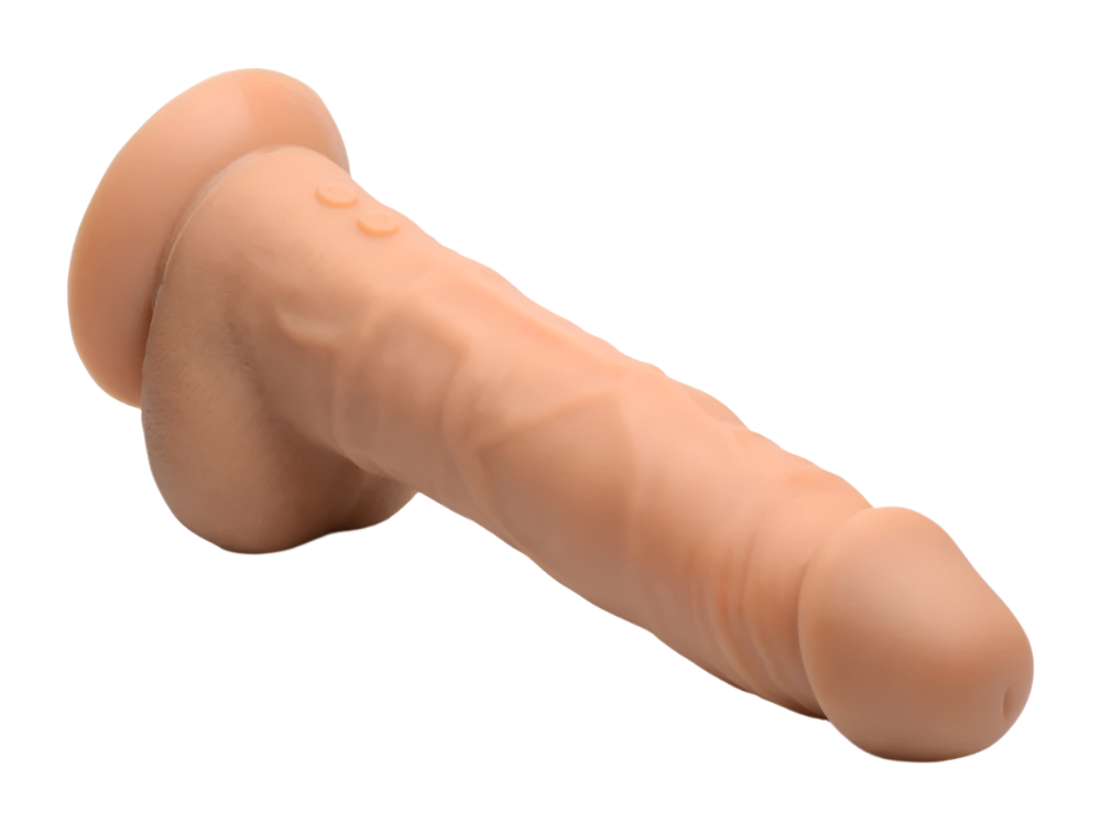 Thrusting Vibrator in flesh color close-up showing silicone texture