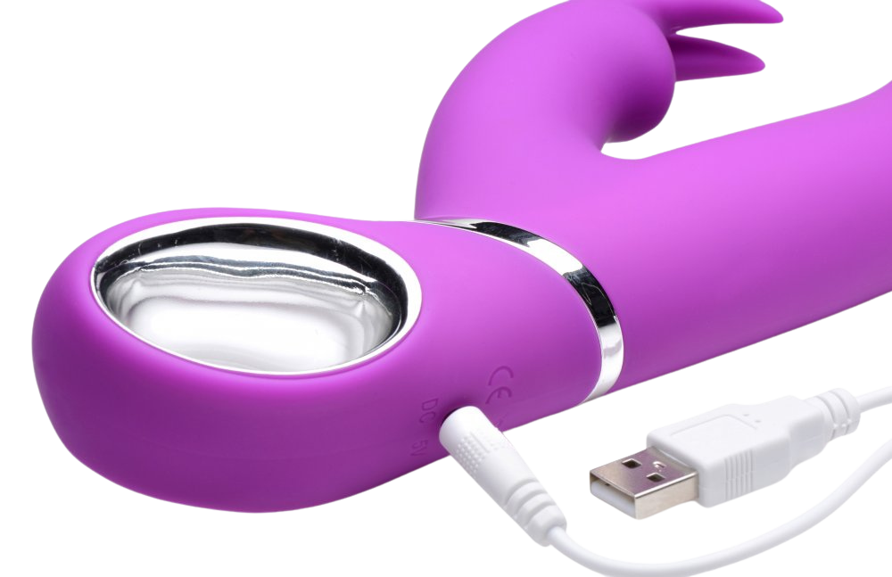 Spinning Silicone Rabbit Vibrator with charging cable connected.